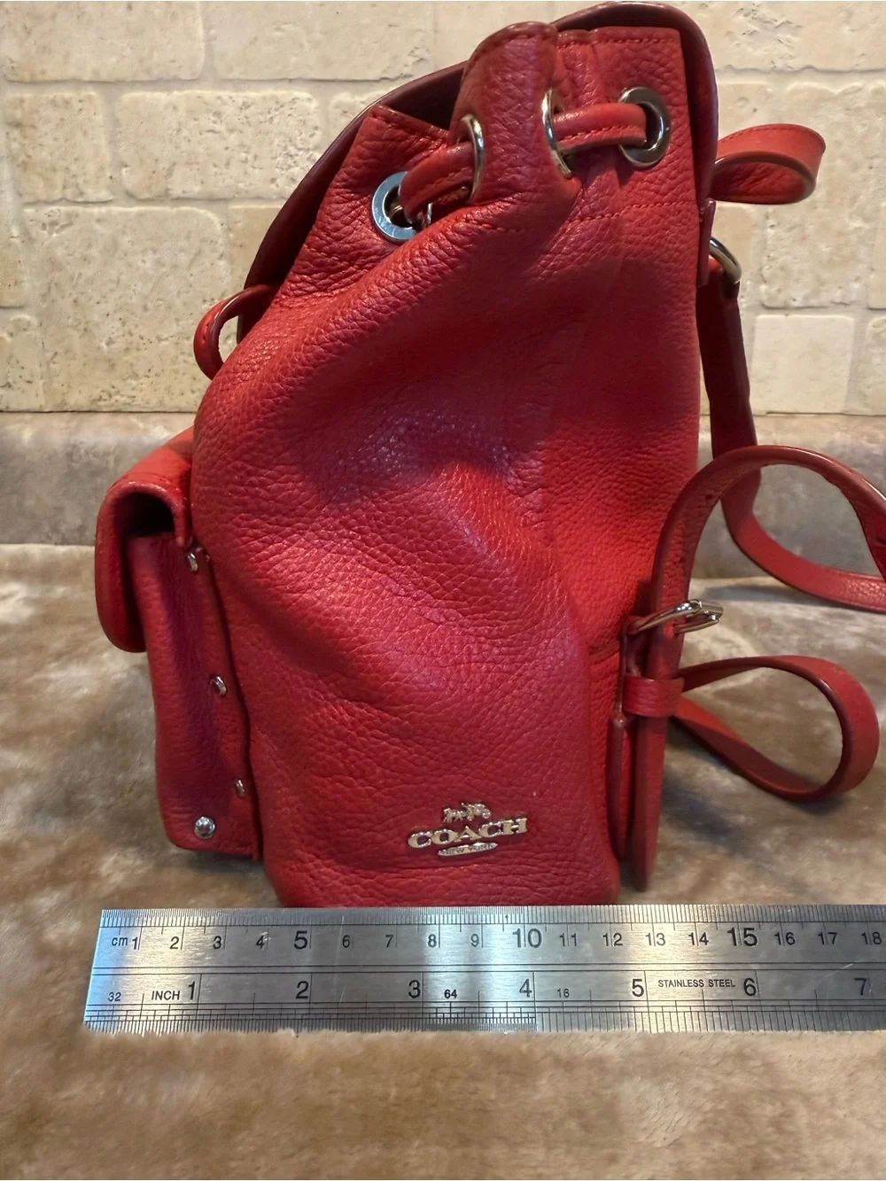 Coach Mini Red Pebble Leather Drawstring Backpack with Front Pocket